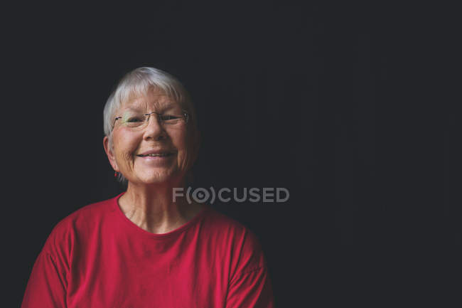 Senior woman smiling — Stock Photo