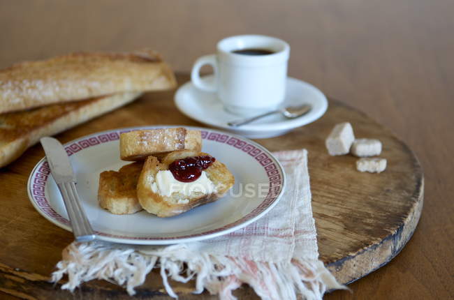 Baguette and cup of coffee — Stock Photo