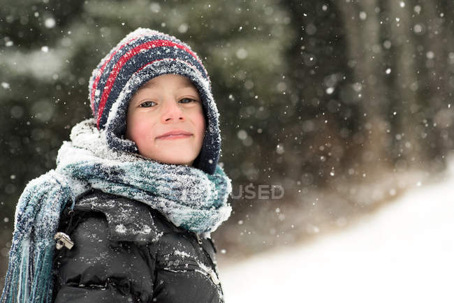 Boy standing in forest — Stock Photo