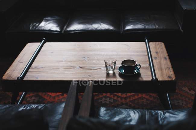 Cup of coffee and glass of water — Stock Photo