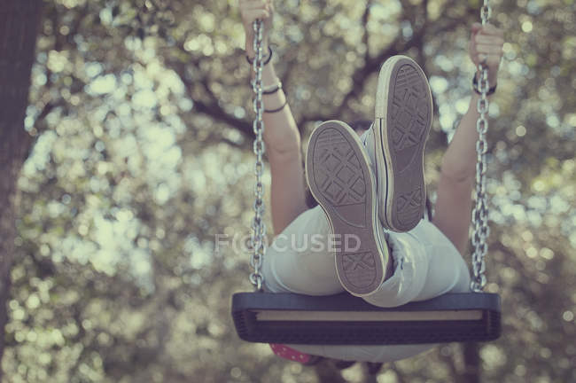 Teenage girl on swing — Stock Photo