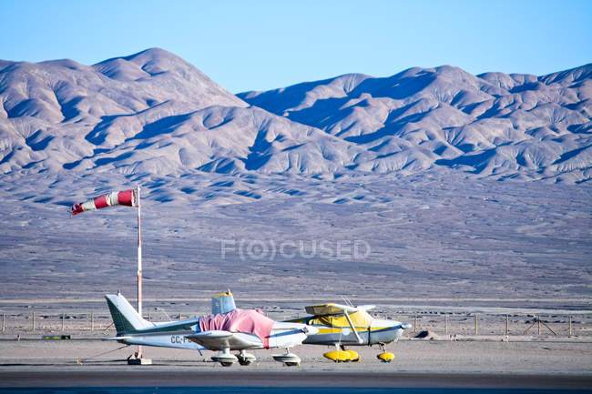 Two small airplanes at airport — Stock Photo