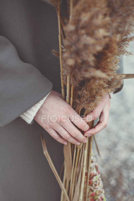 Girl holding reed — Stock Photo