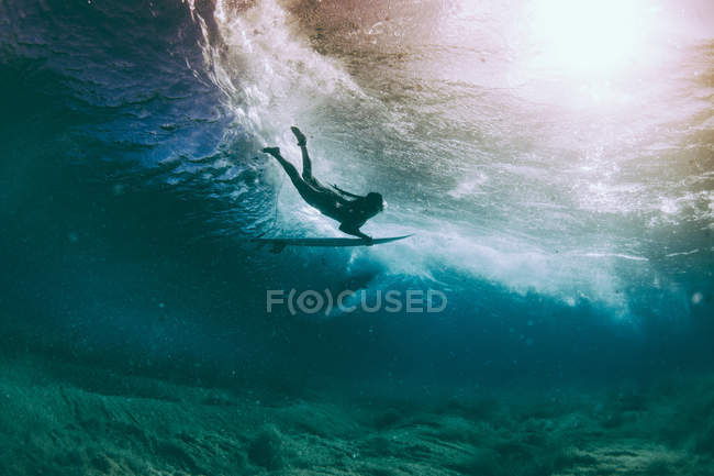Duckdive surfer under water — Stock Photo
