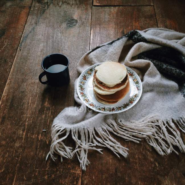 Pancakes and mug of coffee — Stock Photo