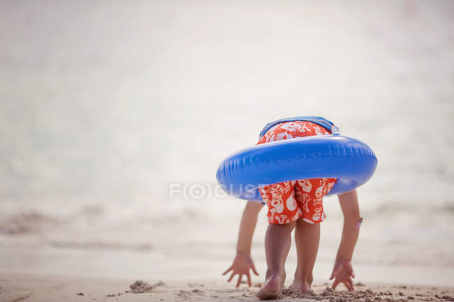 Boy wearing a rubber ring — Stock Photo