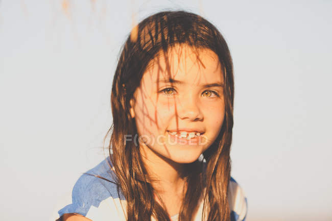 Girl with shadows on face — Stock Photo