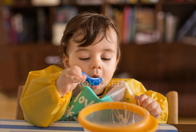 Baby boy eating — Stock Photo