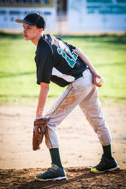 Boy standing on pitchers mound — Stock Photo
