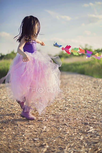Girl in pink tutu spinning around — Stock Photo