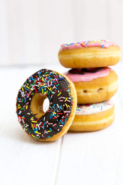 Stack of multi-colored donuts with icing — Stock Photo