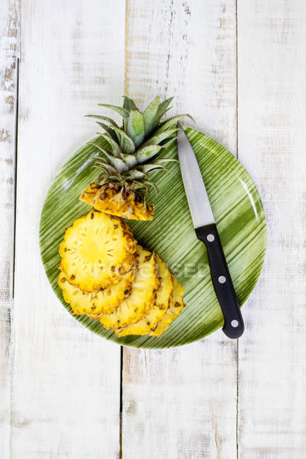 Elevated view of pineapple on plate — Stock Photo