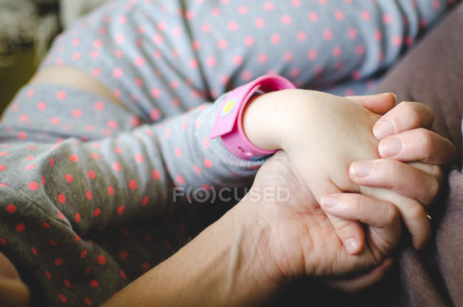 Mother with daughter sitting together — Stock Photo