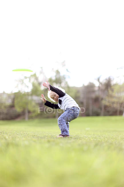 Boy messing about outdoors — Stock Photo