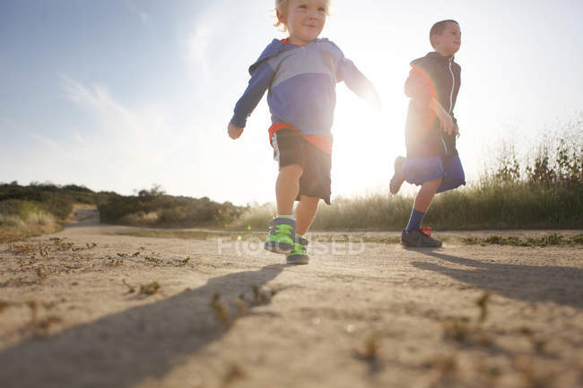 Two boys running — Stock Photo