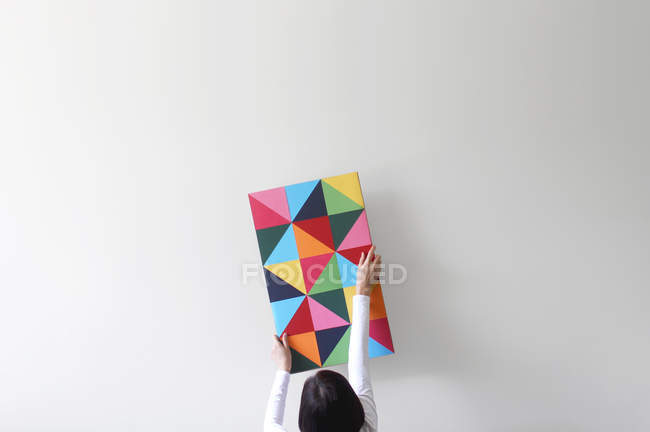 Woman decorating wall — Stock Photo