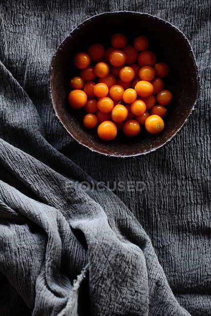 Bowl of baby tomatoes — Stock Photo