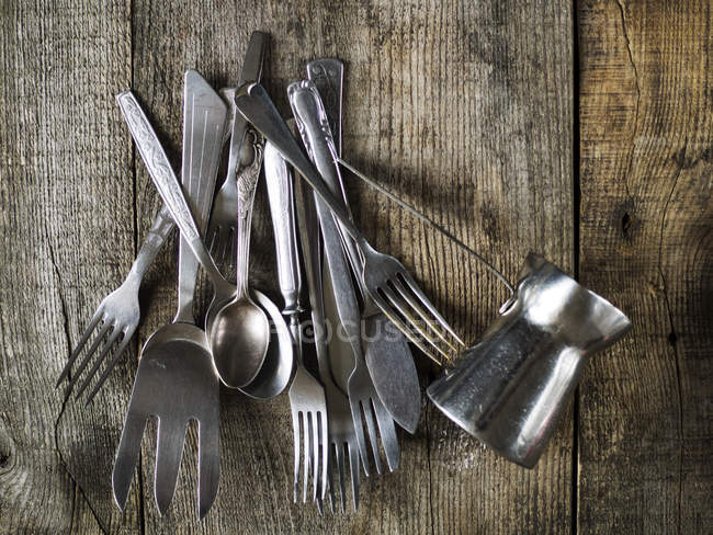 Cutlery on wooden table — Stock Photo