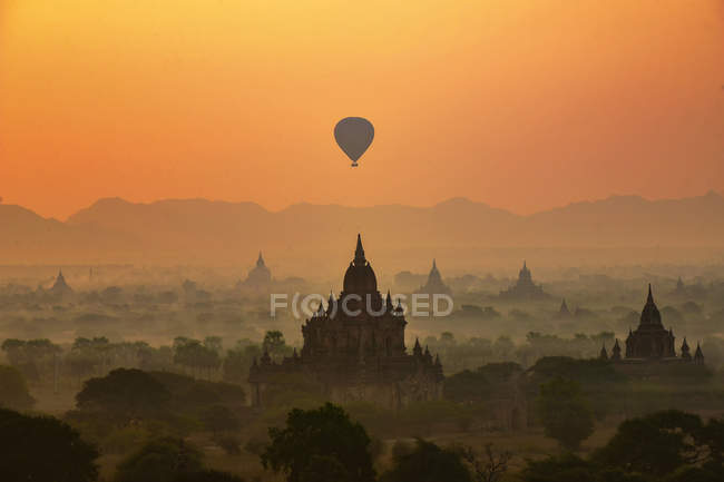 Ancient temples and balloon above — Stock Photo