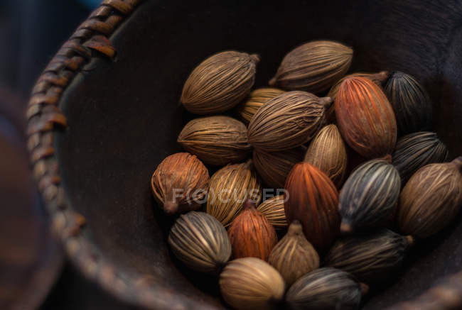 Wooden bowl with dried nuts — Stock Photo