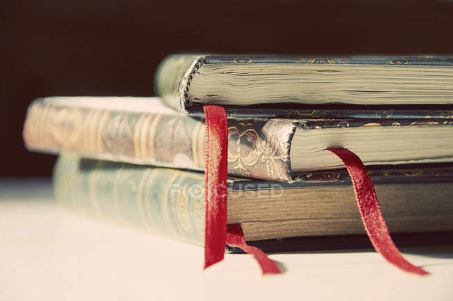 Stack of books with red tassels — Stock Photo
