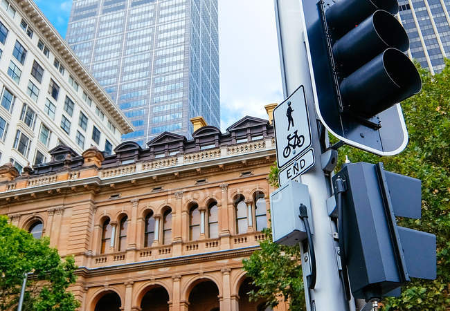 City buildings, traffic light and sign — Stock Photo