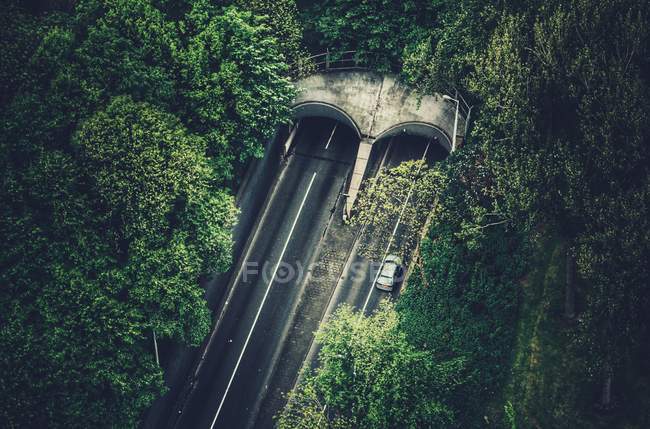 Car driving into tunnel — Stock Photo
