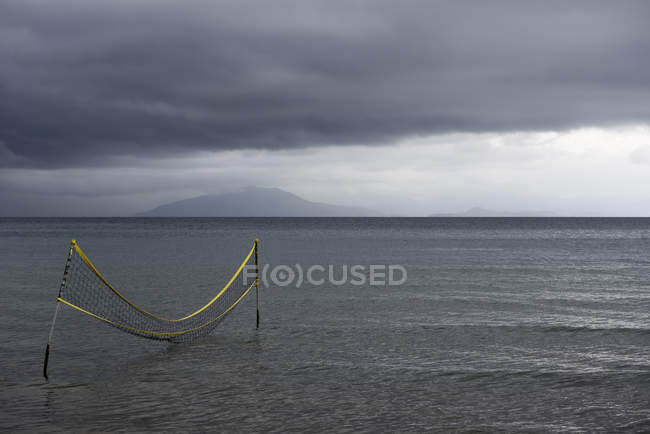 Water volleyball net in ocean — Stock Photo