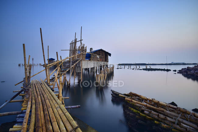 Scenic view of wooden jetty and houses, Ancol, Jakarta, Indonesia — Stock Photo