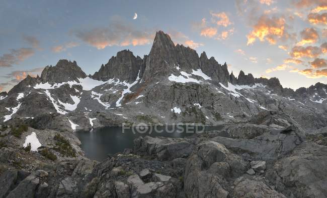 USA, California, Moon Setting over Minarets in Inyo National Forest — Stock Photo