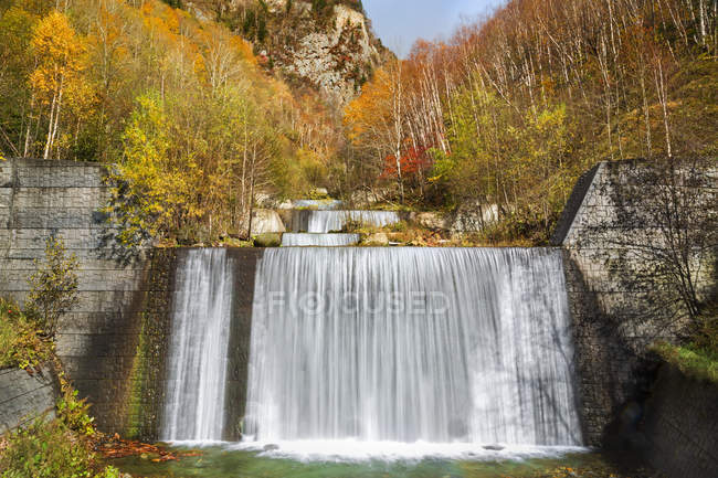Scenic view of forest waterfall in autumn Hokkaido, Japan — Stock Photo