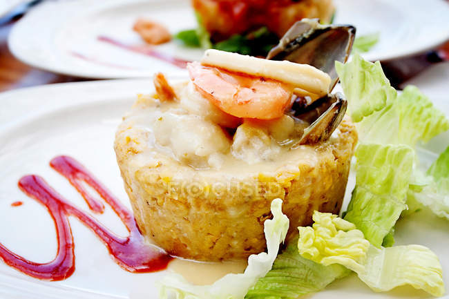 Tempting mofongo dish over white plate at restaurant — Stock Photo