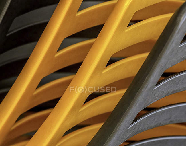 Close-up view of stacked plastic chairs — Stock Photo