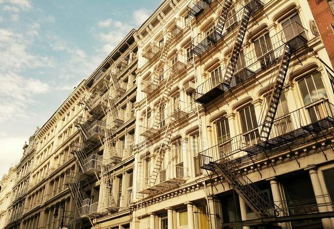 Fire escapes on apartment building in New York City, USA — Stock Photo