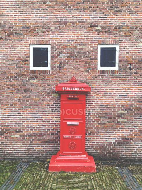 Red Letterbox near Building, Holland — Stock Photo