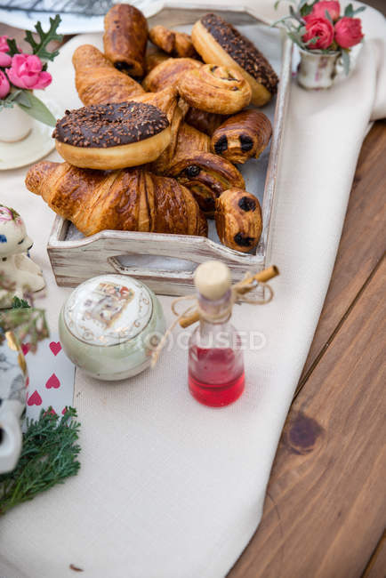 Tray of croissants, pain au chocolate and donuts — Stock Photo