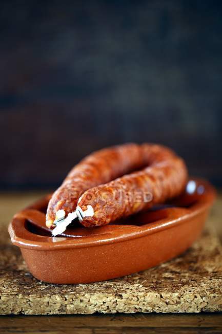 Portugal chorizo on clay bowl, closeup — Stock Photo