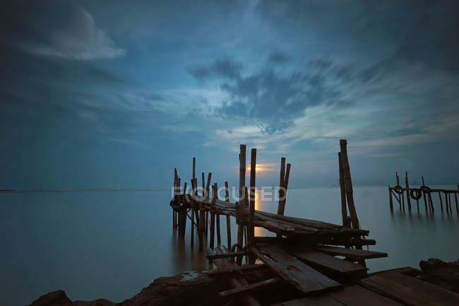 Scenic view of bamboo dock at sunrise, Cirebon, Indonesia — Stock Photo