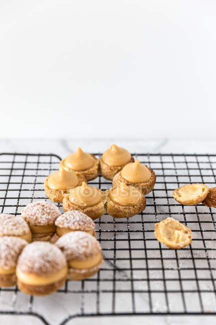 Paris Brest with caramel custard on a cooling tray — Stock Photo