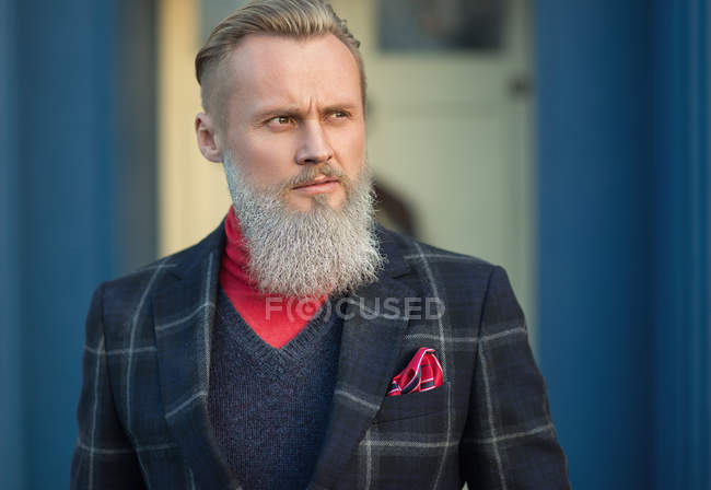 Portrait of funky hipster man looking sideways — Stock Photo