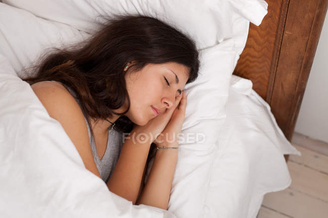 Close-up of Teenage girl sleeping in bed — Stock Photo