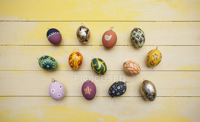 Hand painted easter eggs on wooden table — Stock Photo
