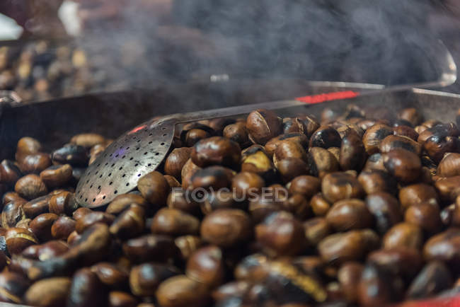 Close-up of roasted chestnuts in market, Bordeaux, France — Stock Photo