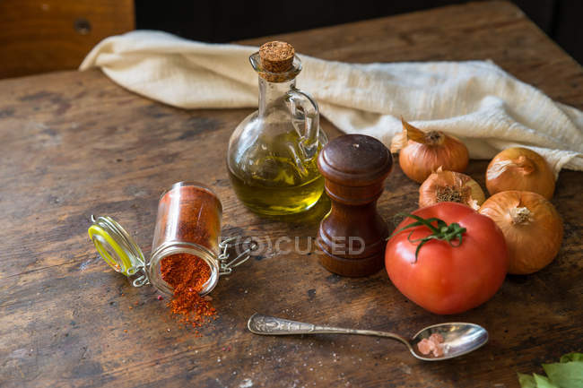 Elevated view of vegetables and spices on wooden table — Stock Photo