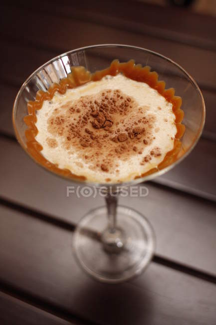 Closeup view of fantasy cocktail over wooden table — Stock Photo