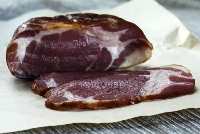 Slices of Italian prosciutto crudo raw ham — Stock Photo