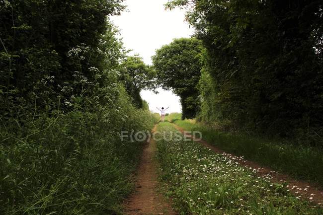 Woman standing at end of footpath, Niort, France — Stock Photo