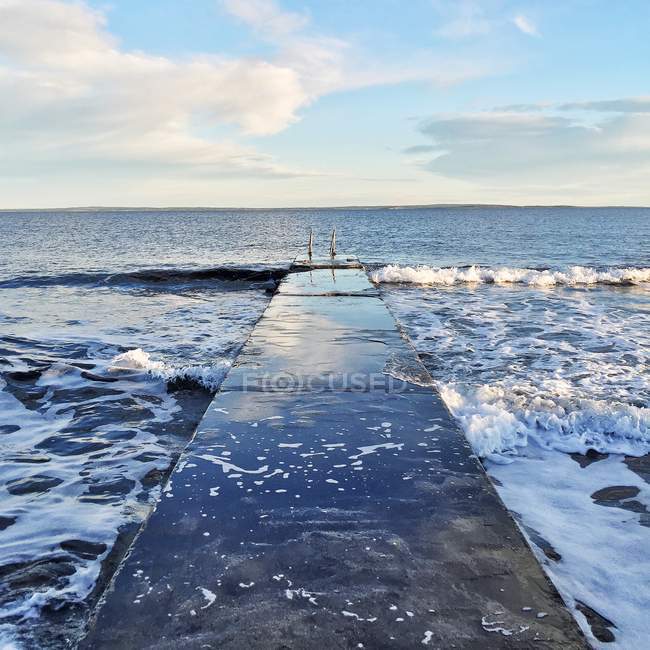 Scenic view of empty jetty by the sea — Stock Photo