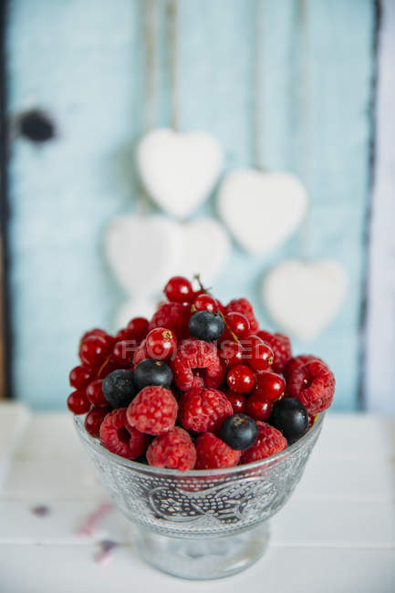 Metal Bowl of fresh blueberries, raspberries and redcurrants — Stock Photo
