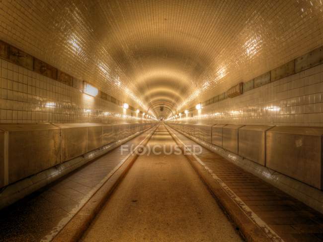 View along illuminated tunnel, Elbtunnel, Hamburg, Germany — Stock Photo